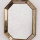 Octagonal mirror in Venetian style with gold-rimmed parecloses