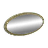 Vintage oval mirror with a ribbed sage green frame.