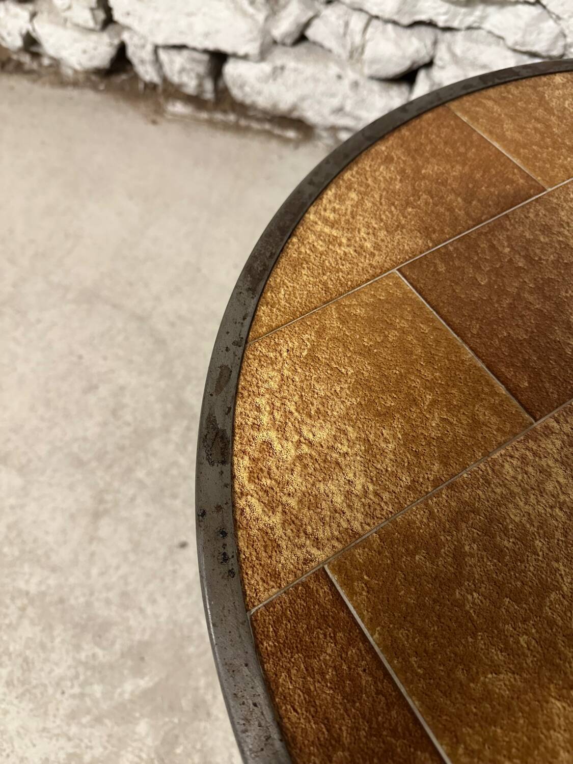 Vintage round ceramic and wrought iron coffee table