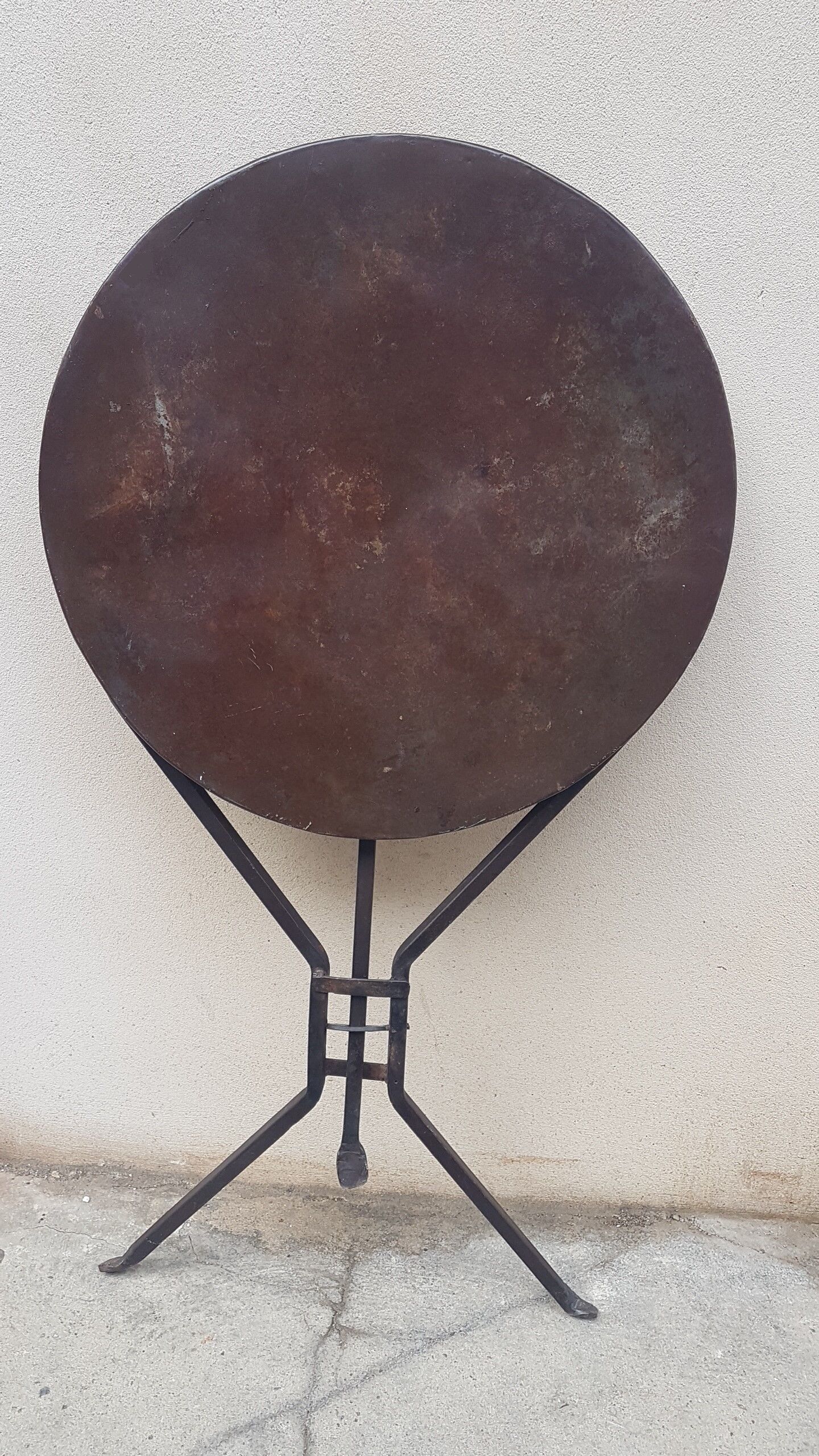 Old foldable tripod pedestal table