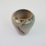 Small beige glazed ceramic vase with abstract relief pattern