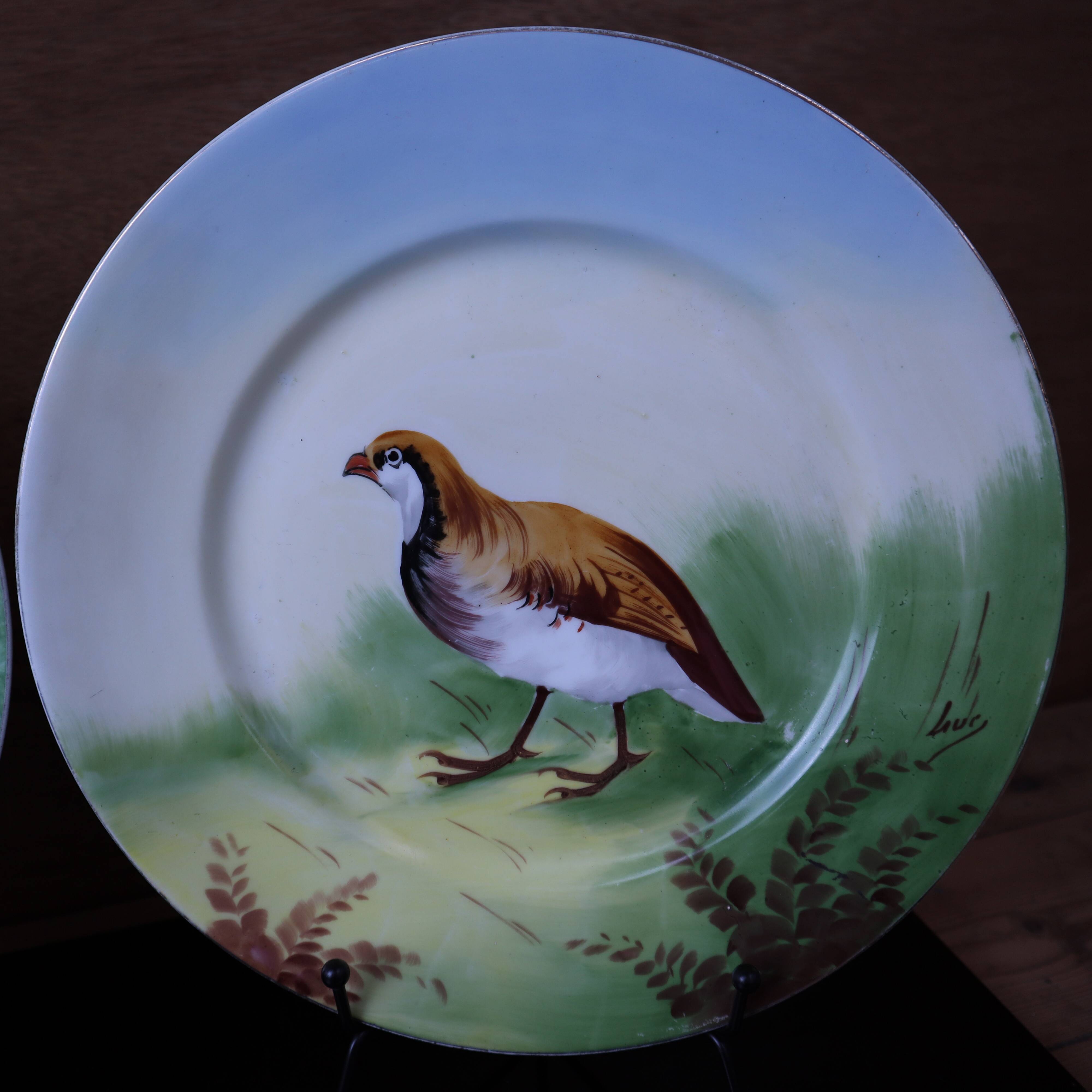 3 decorative porcelain plates from Limoges featuring partridges and pheasants.