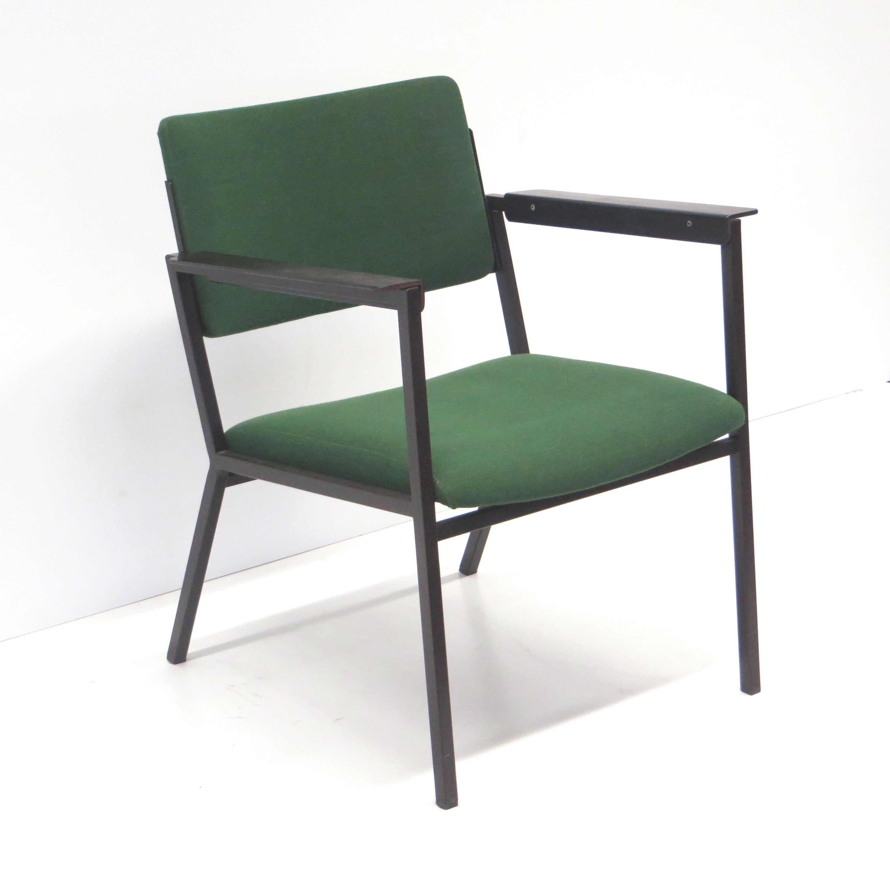 Green vintage armchair with metal frame made in the 60s