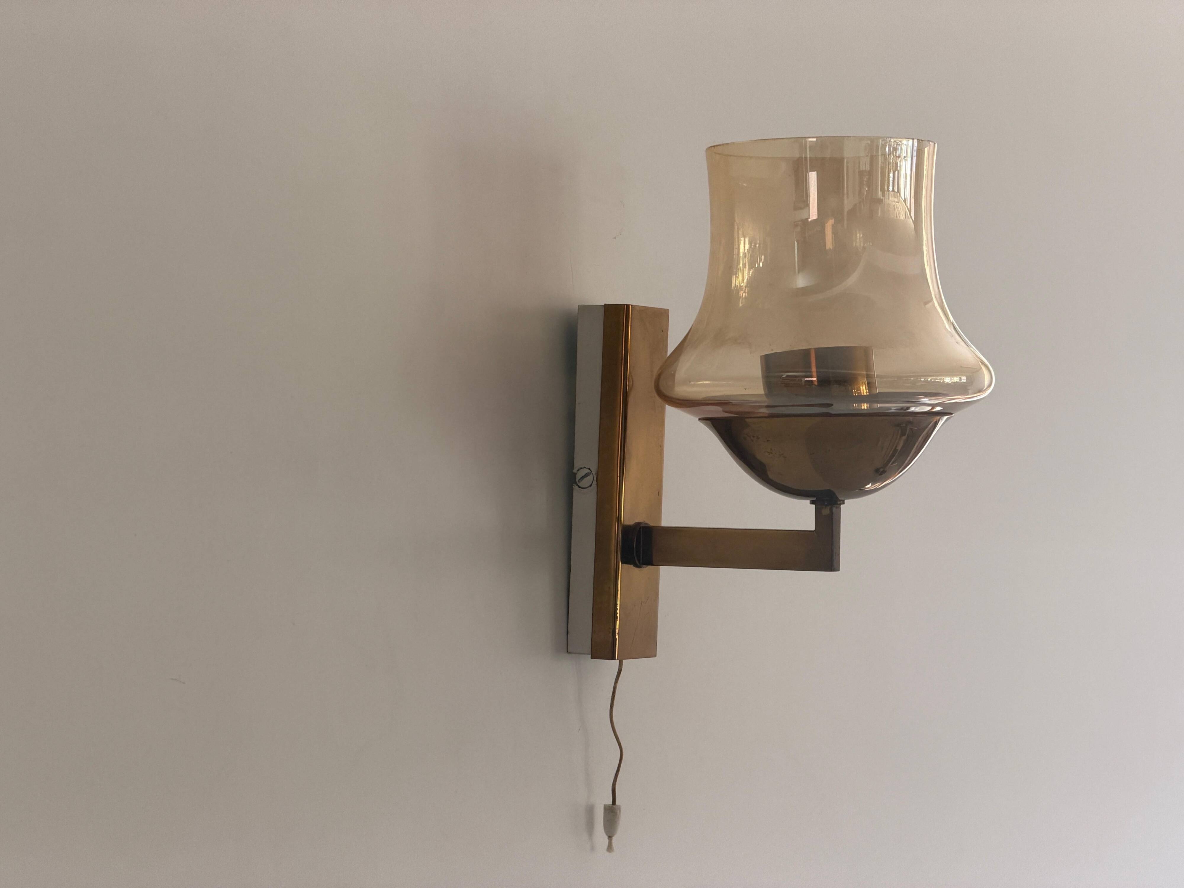 Yellow glass and brass wall light from the mid-century, 1960, Germany.