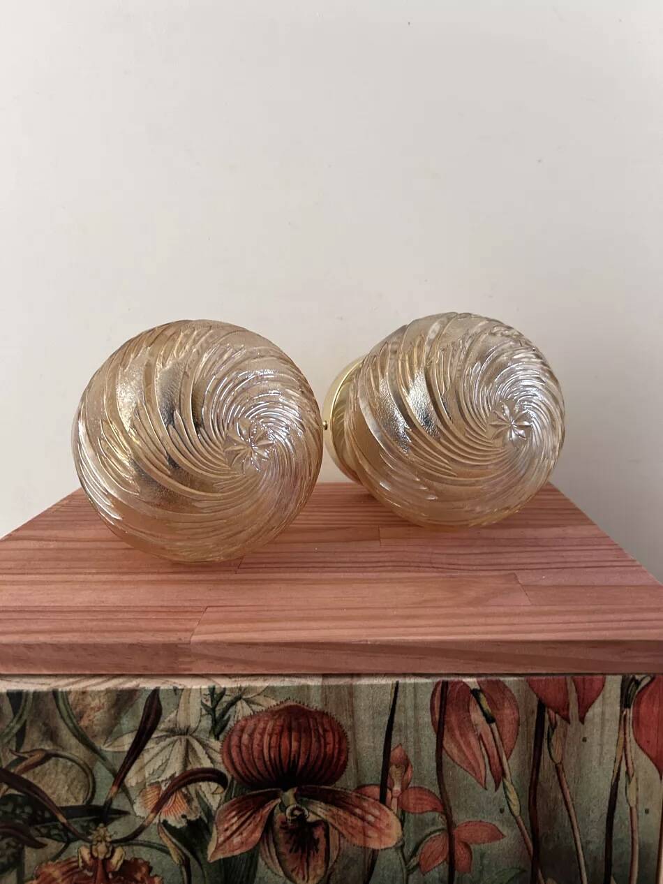 Pair of golden globe wall lights