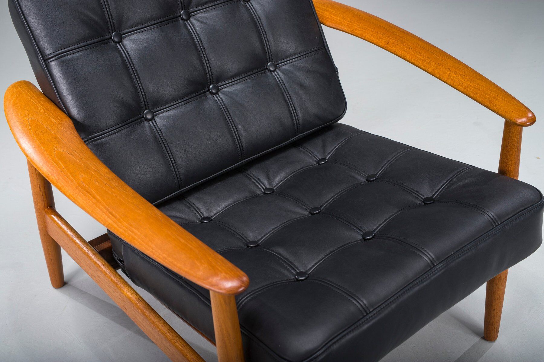 Armchair with Model FD 164 frame by Arne Vodder and Model 118 armrests by Grete Jalk in teak and black leather, Denmark, 1960s