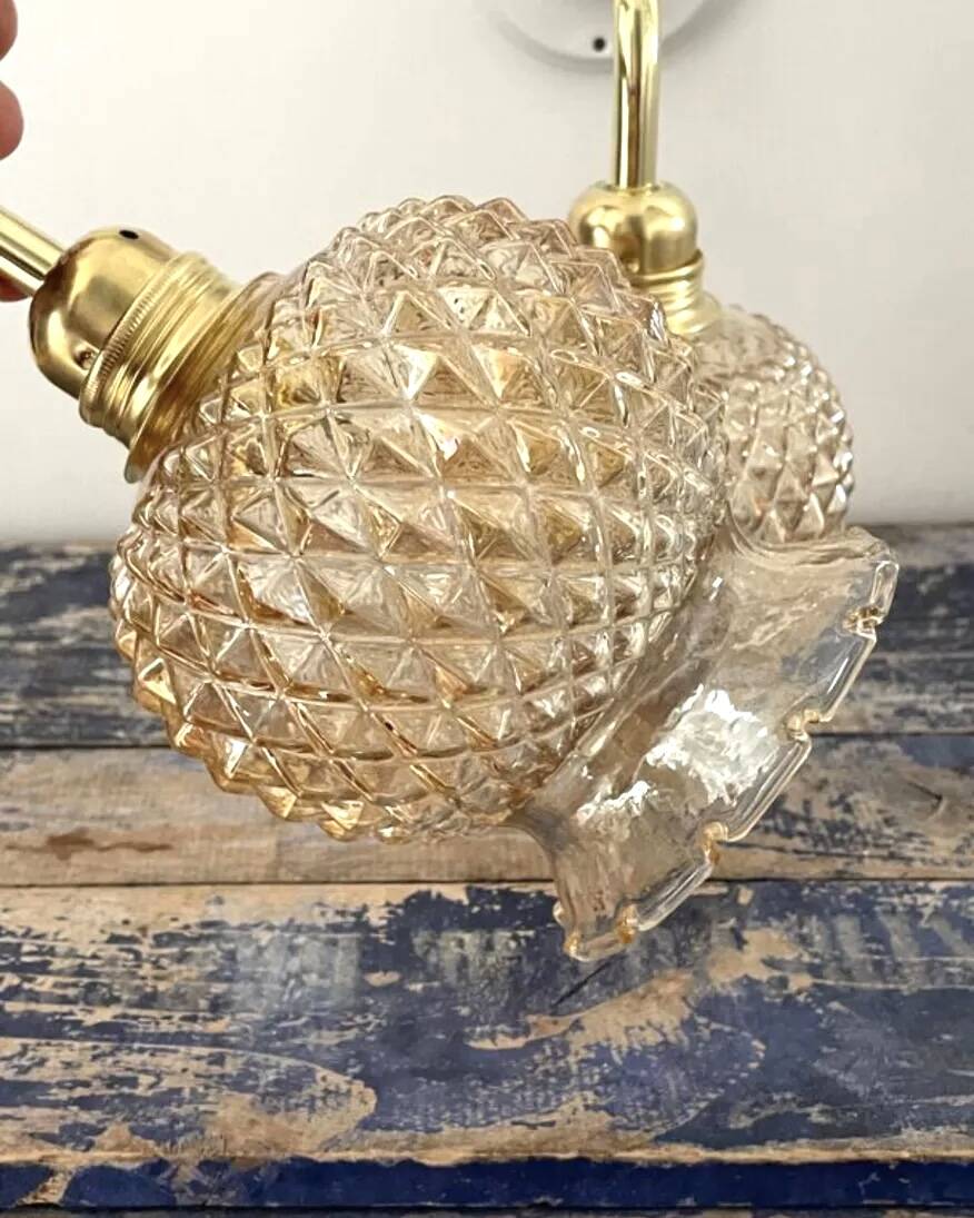 Pair of golden globe wall lights
