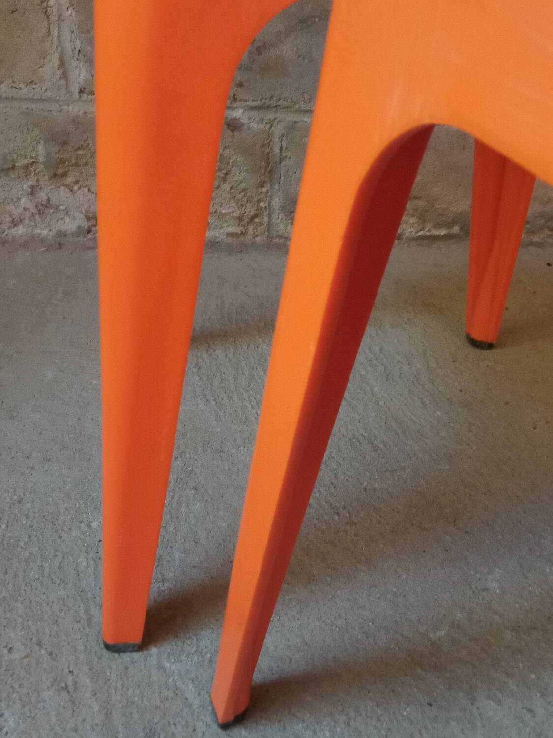 Pair of AMI stools in orange plastic