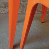 Pair of AMI stools in orange plastic