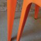 Pair of AMI stools in orange plastic