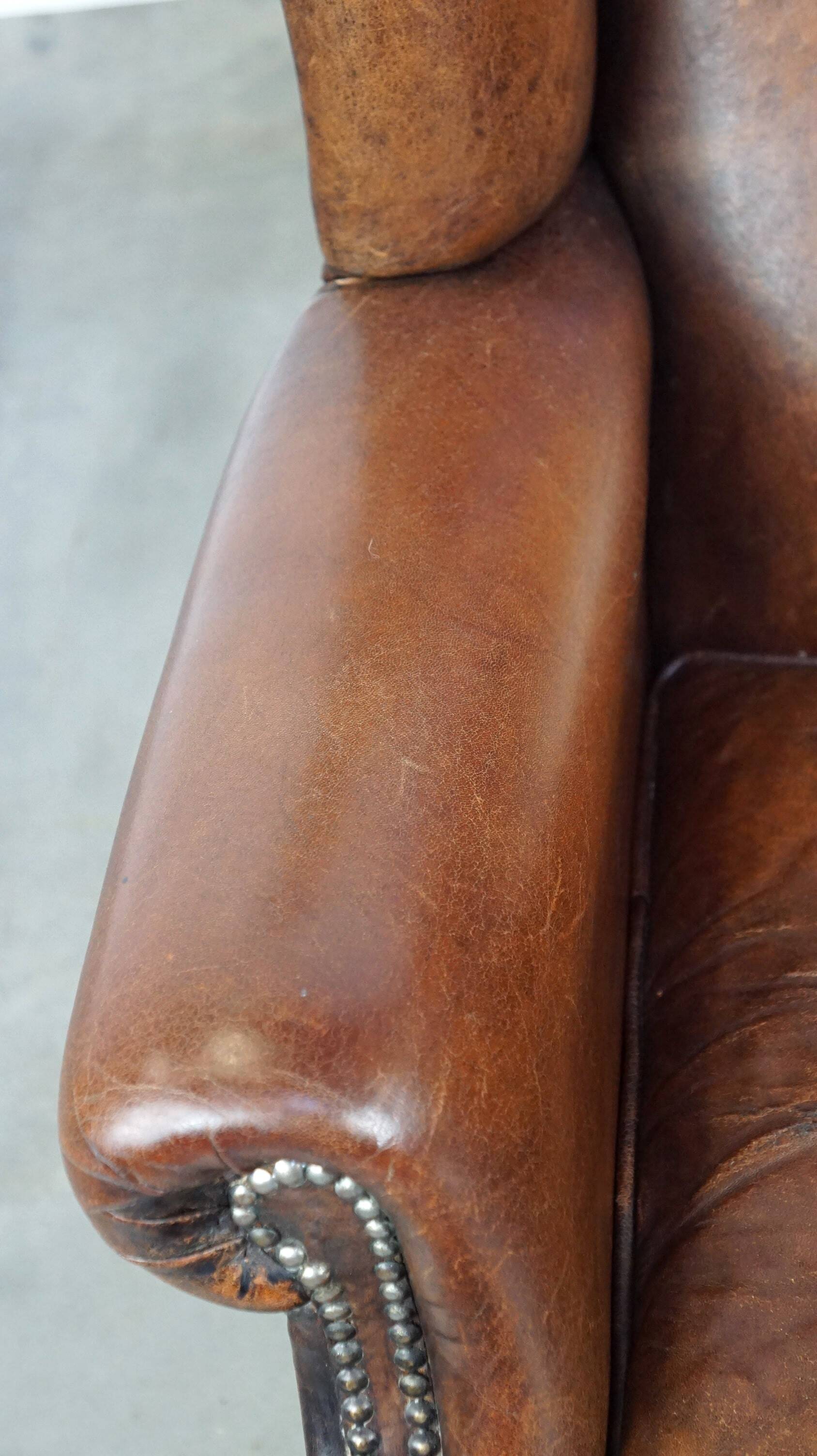 Large sheepskin wing chair with excellent colour and great seating comfort
