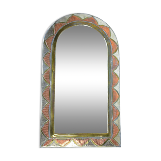 Decorated brass mirror.