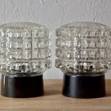 Old pair of molded glass and Bakelite wall or ceiling lights