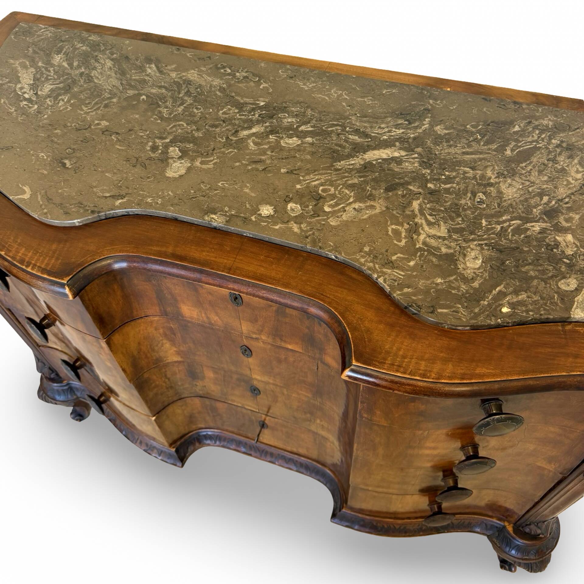 serpentine commode in antique walnut