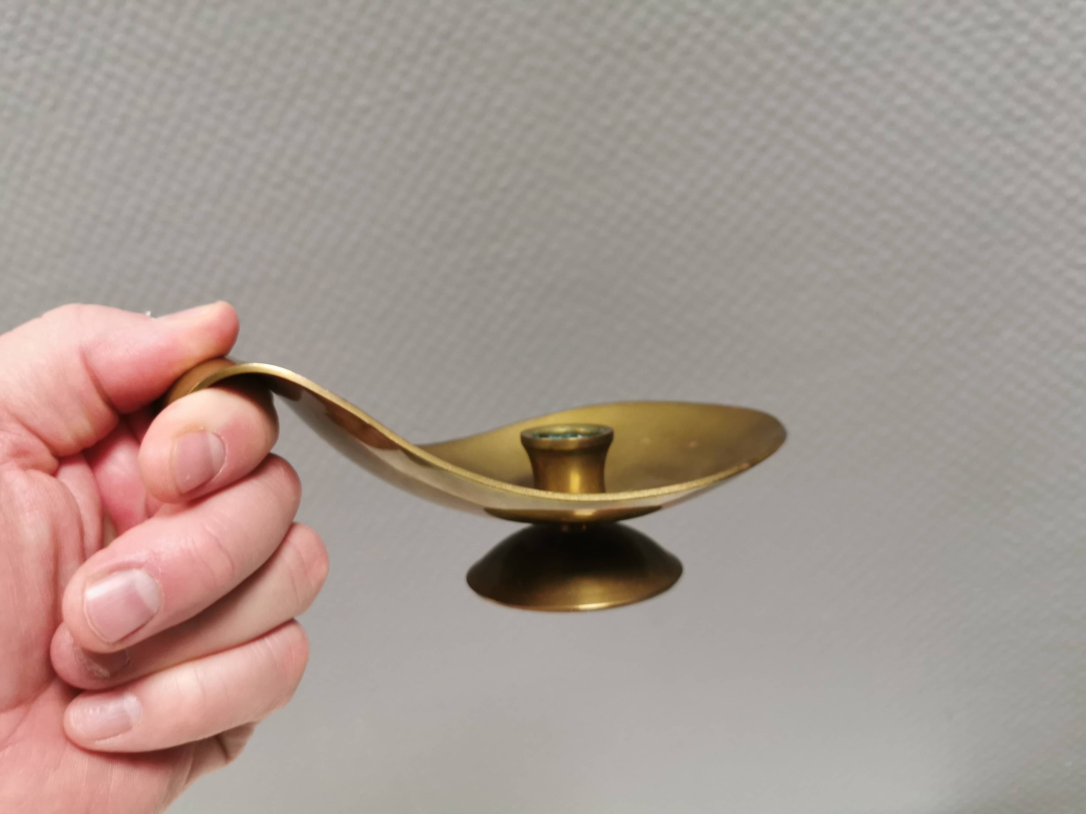 Brass candlestick for a single candle