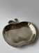 Silver metal apple pocket emptier