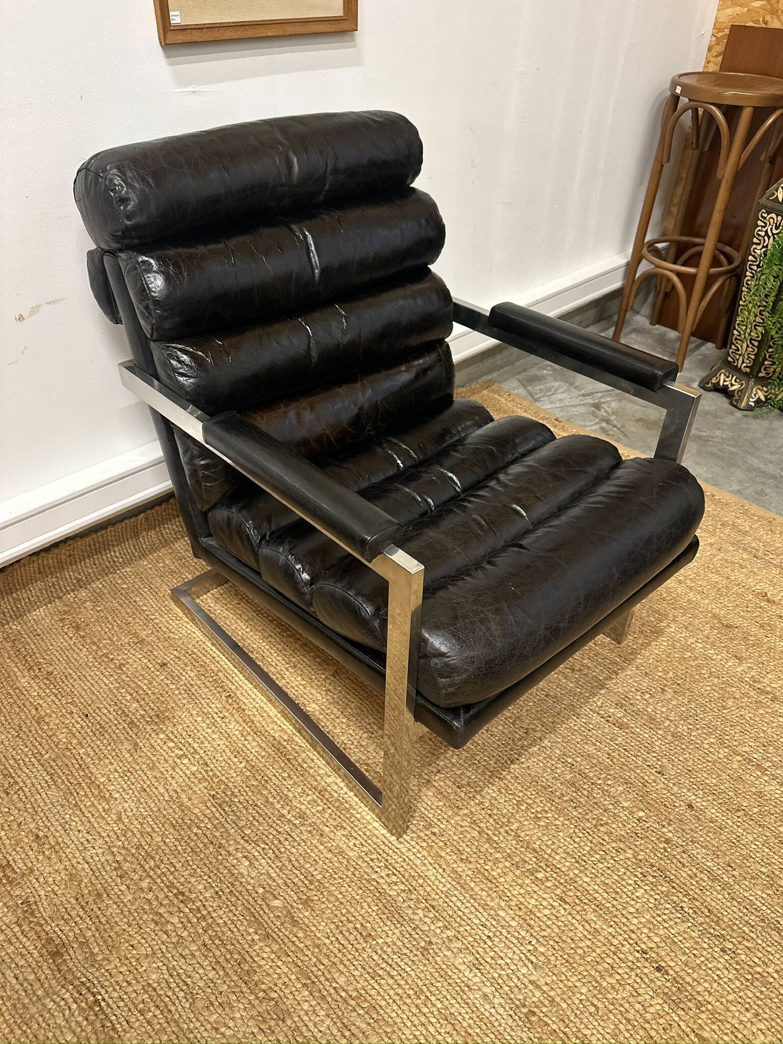 Vintage 1970s black leather armchair – metal frame