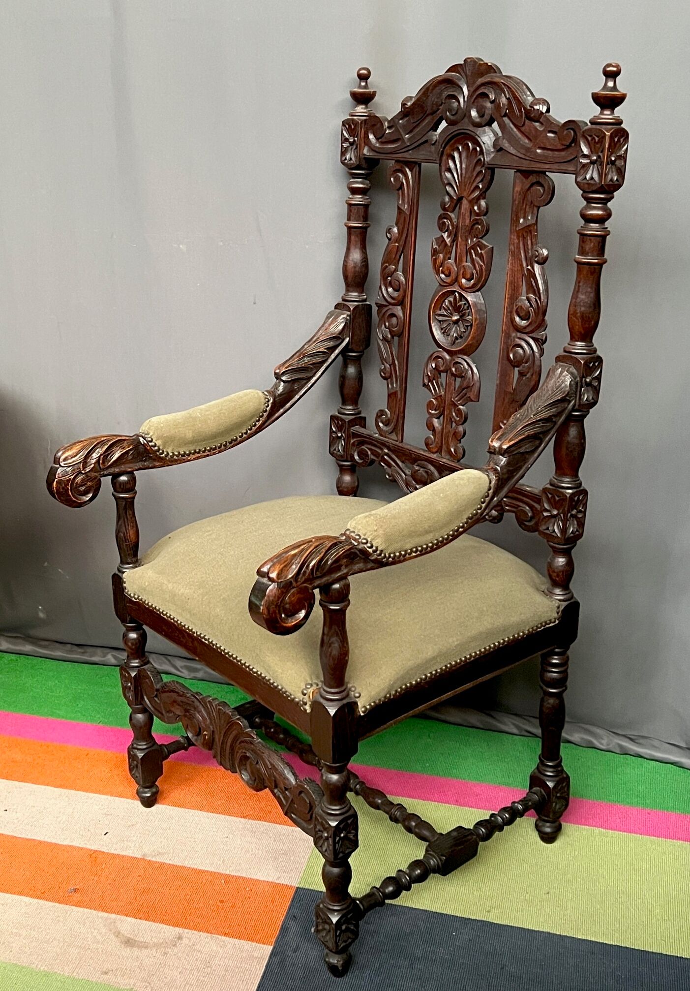 Renaissance-style oak armchair, hand-carved deep sculpture.