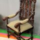 Renaissance-style oak armchair, hand-carved deep sculpture.
