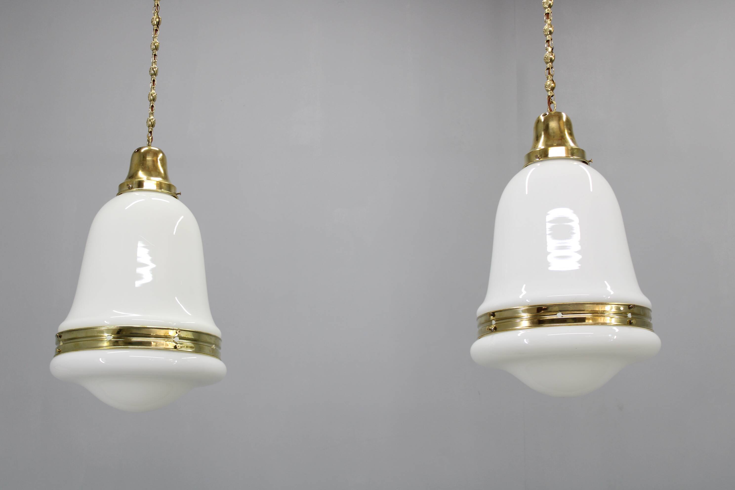 Pair of 1930s Peter Behrens Luzette pendants in opaline glass and brass
