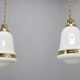 Pair of 1930s Peter Behrens Luzette pendants in opaline glass and brass