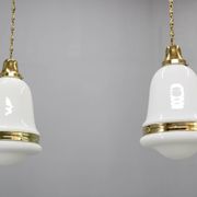 Pair of 1930s Peter Behrens Luzette pendants in opaline glass and brass