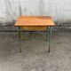 Vintage school desk made of wood and green metal - inkwell hole - antique.