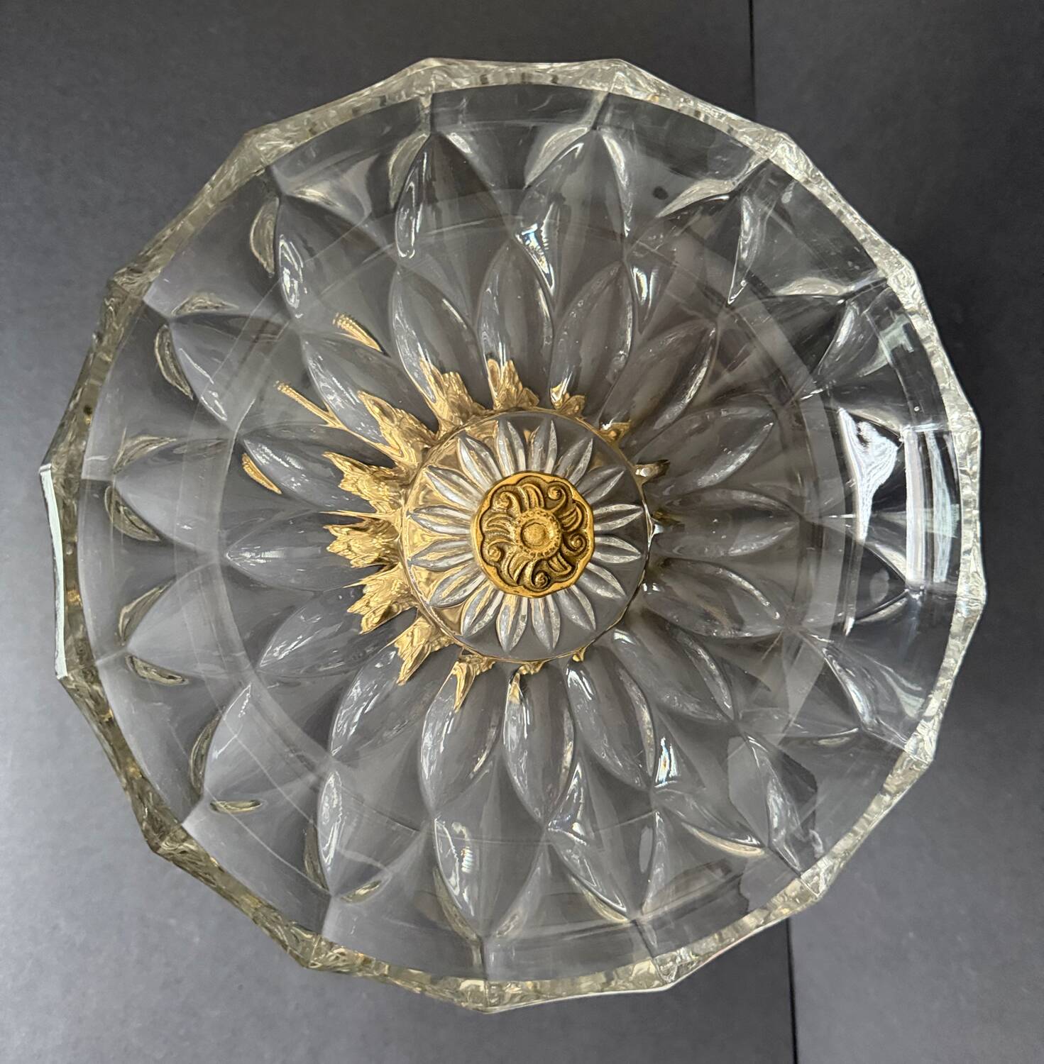 Antique crystal bowl on a bronze stand.