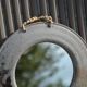 Round ceramic mirror signed