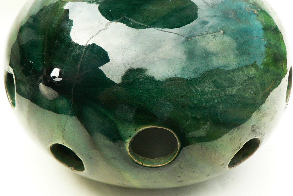 details on old bulb pot in glazed earthenware