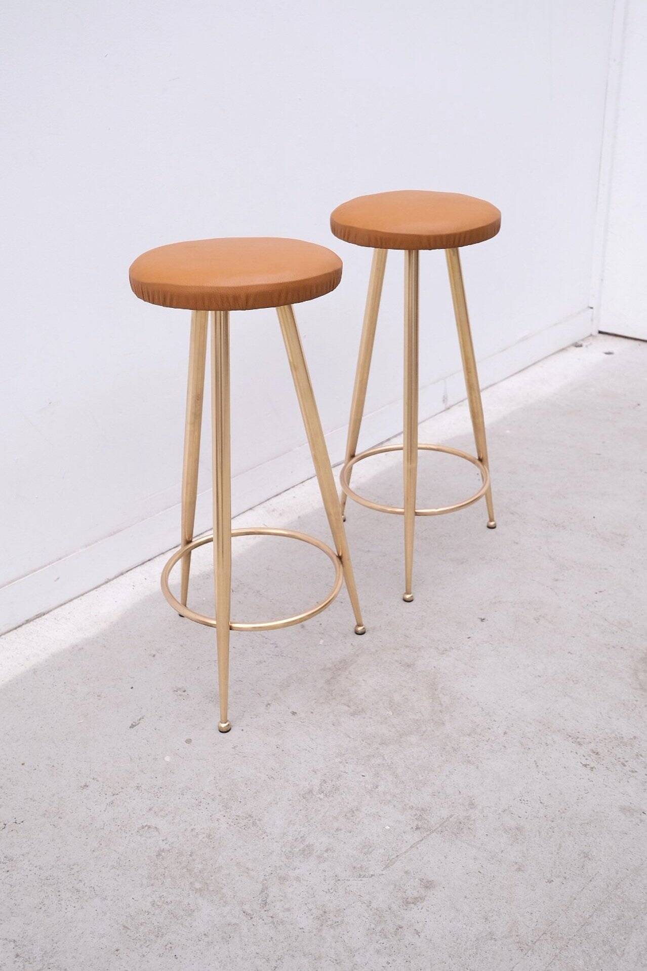 Pair of brass and leather stools, Italy 1960