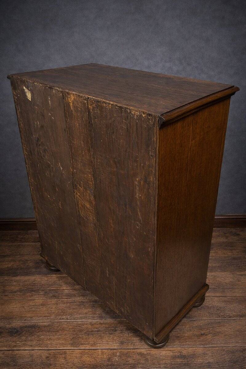 Ornamental piece of solid wood furniture, richly carved, dating from the 17th century.