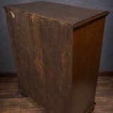 Ornamental piece of solid wood furniture, richly carved, dating from the 17th century.