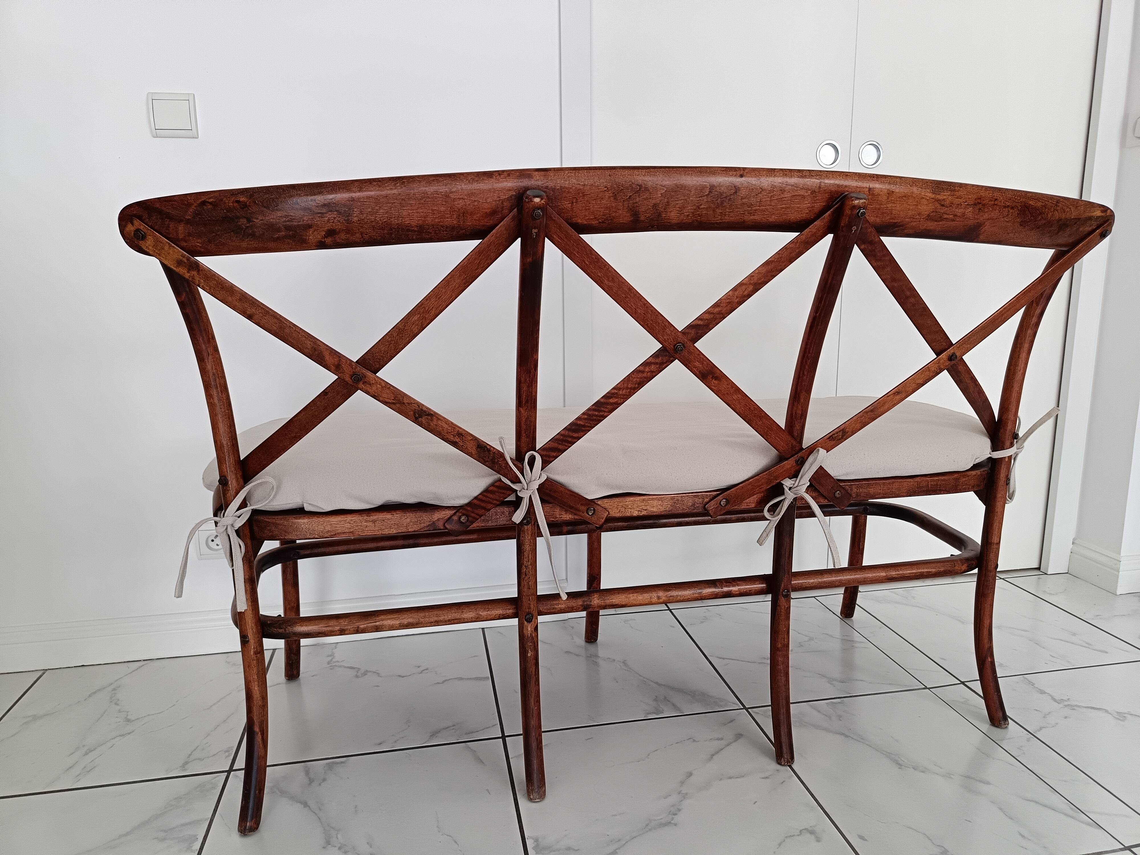 CURVED WOOD AND CANE BENCH