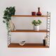 Scandinavian Hylla teak wall shelf with brass label