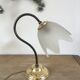 Table lamp with glass globe and brass foot
