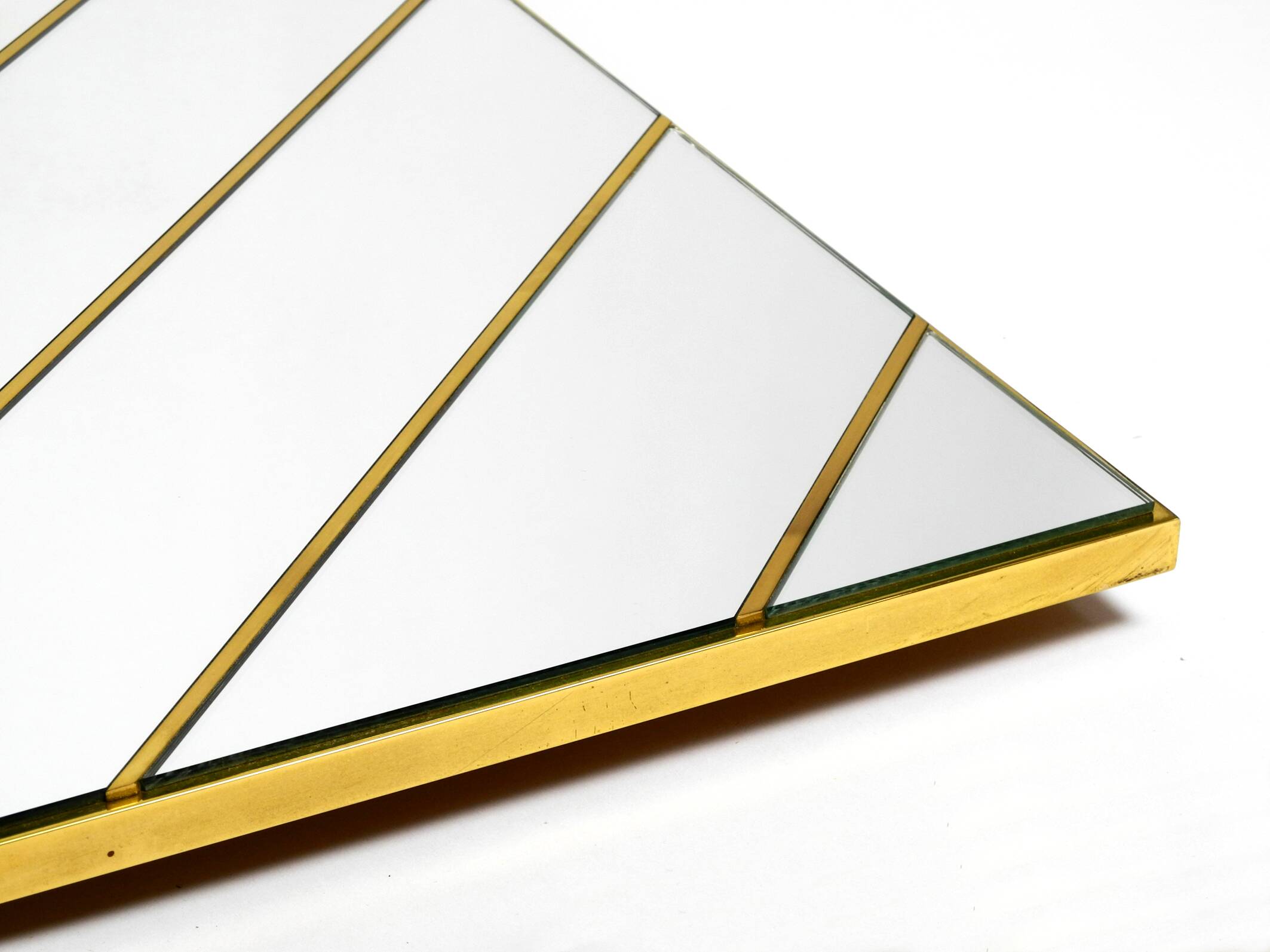 Large, exceptional 1970s brass wall mirror with diagonal mirror strips