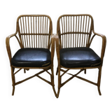 Pair of vintage rattan and leatherette armchairs