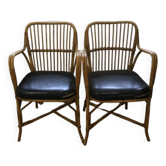 Pair of vintage rattan and leatherette armchairs