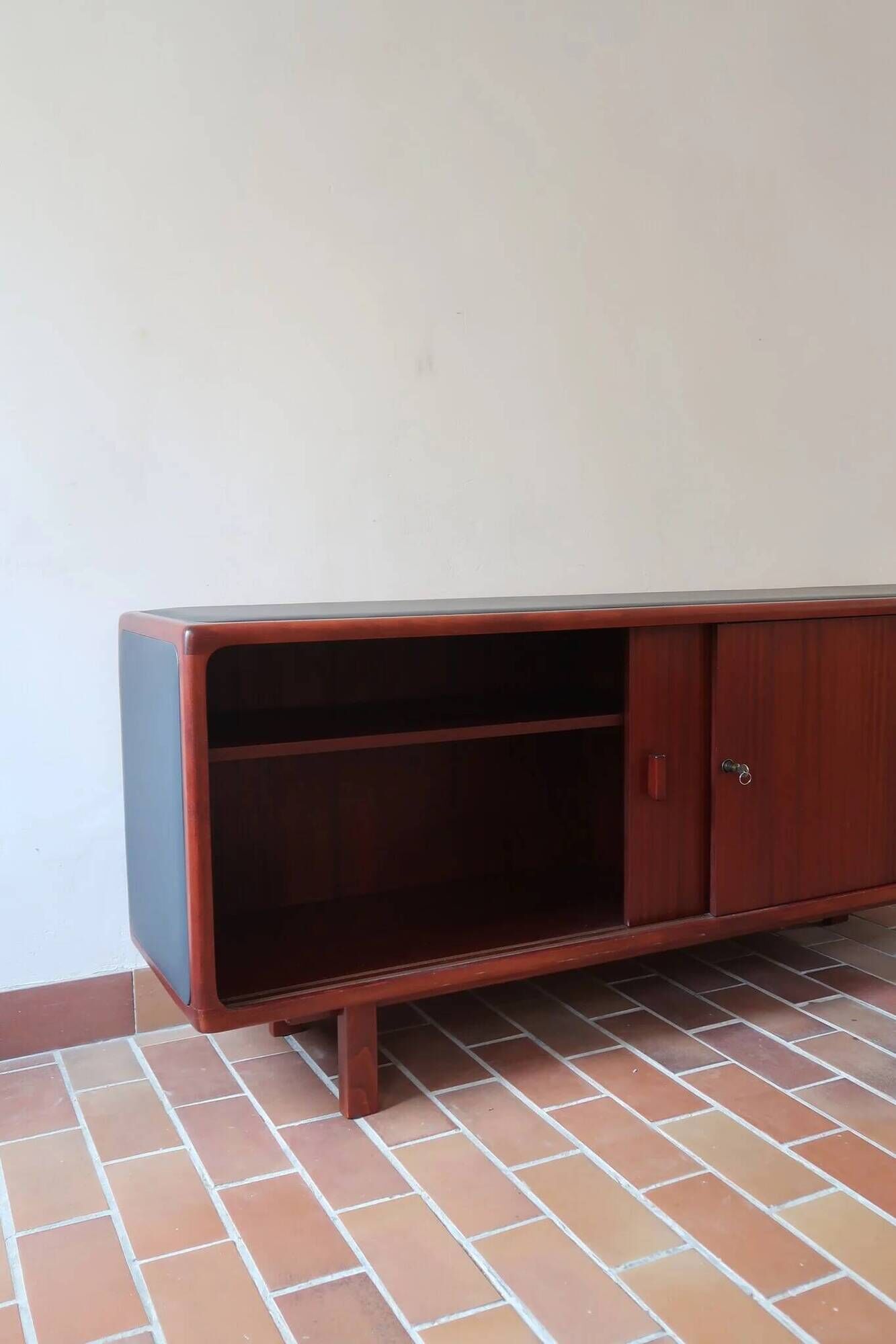 Teak enfilade, sliding doors, black faux leather top, 1970s.