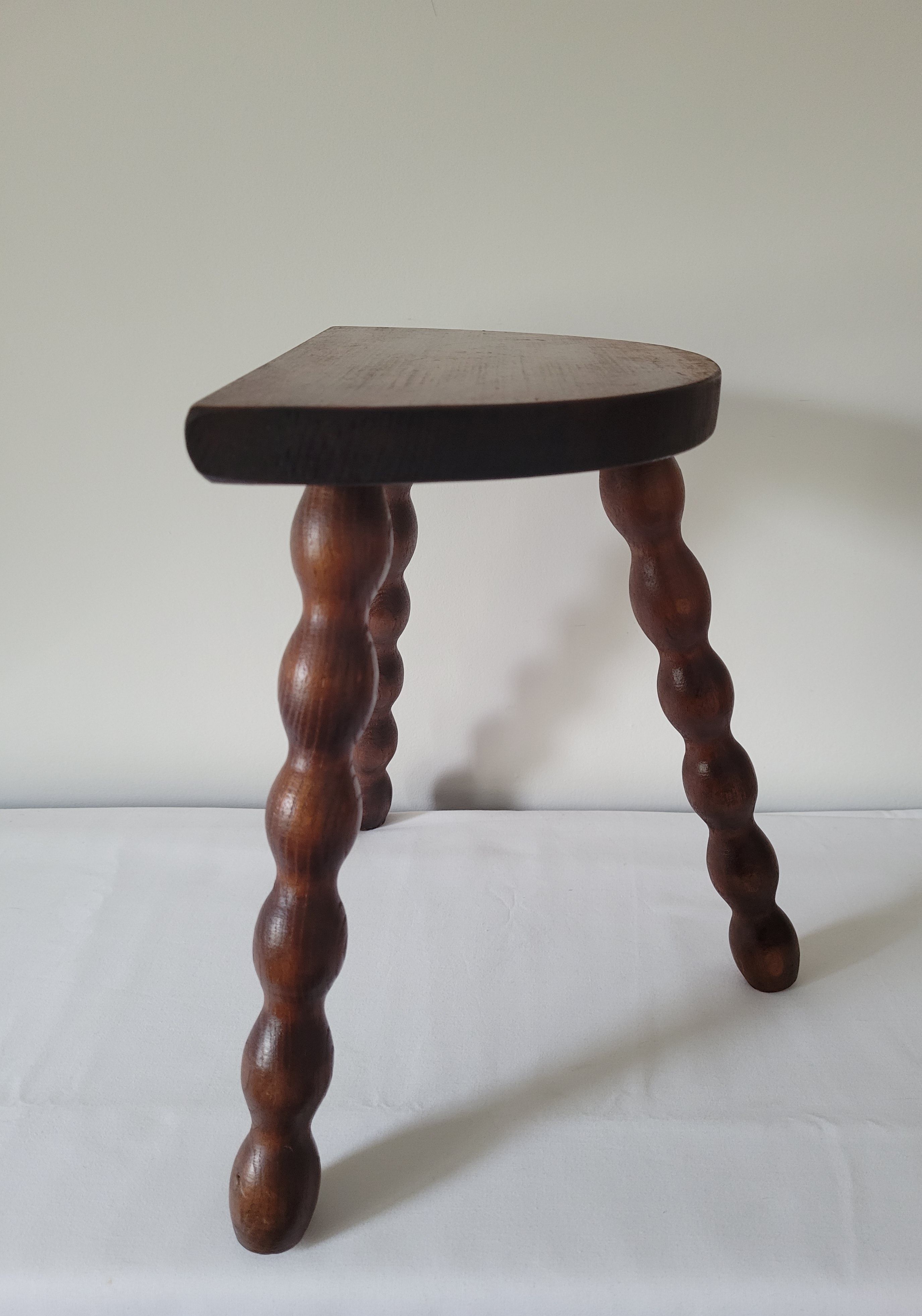 Brutalist stool turned wooden feet