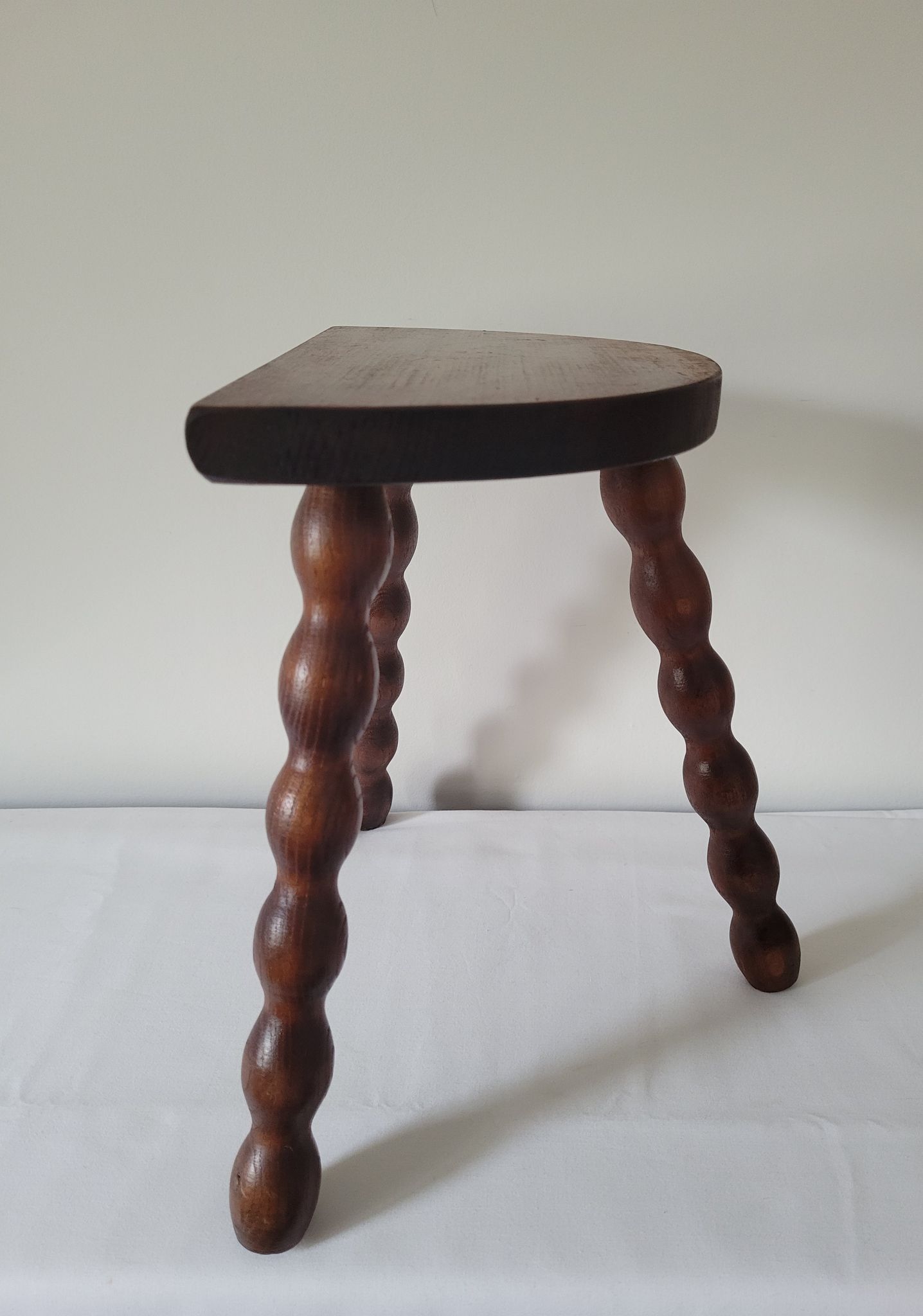 Brutalist stool turned wooden feet