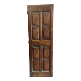 Ancienne porte de placard XVIIIème en noyer composée de 8 panneaux finement sculptés