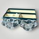 Pair of crystal salt shakers and glass spoons signed Daum Cristal