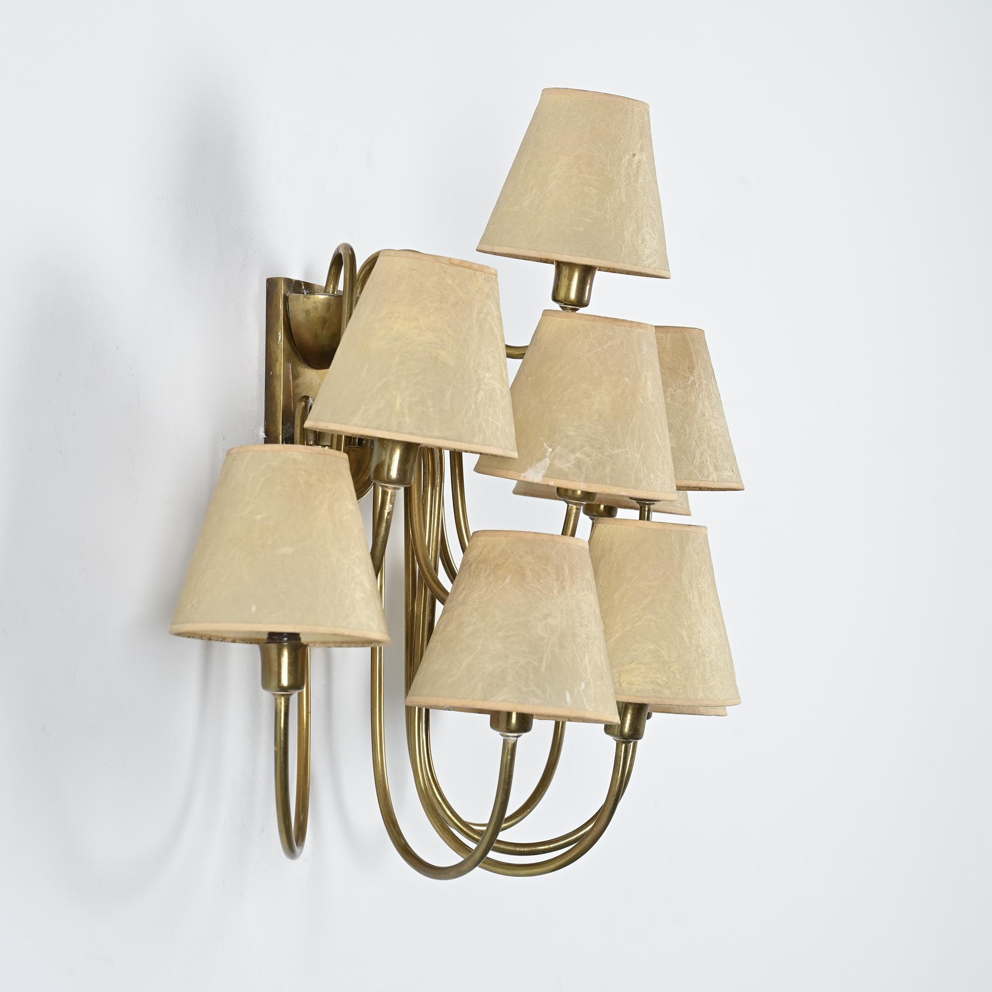 Wall sconce with nine arms in brass, France, circa 1950.