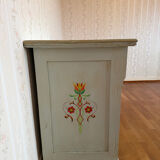 Antique low polychrome sideboard with floral decoration.