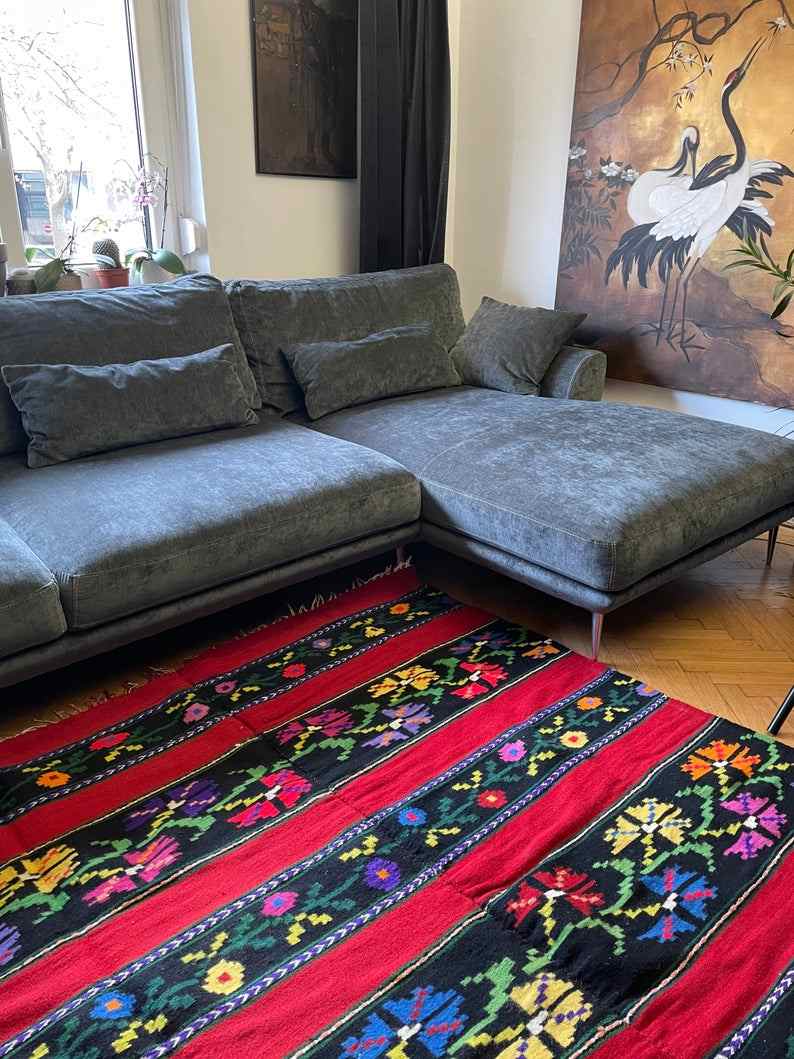 Romanian wool rug, red background with delicate colourful flowers