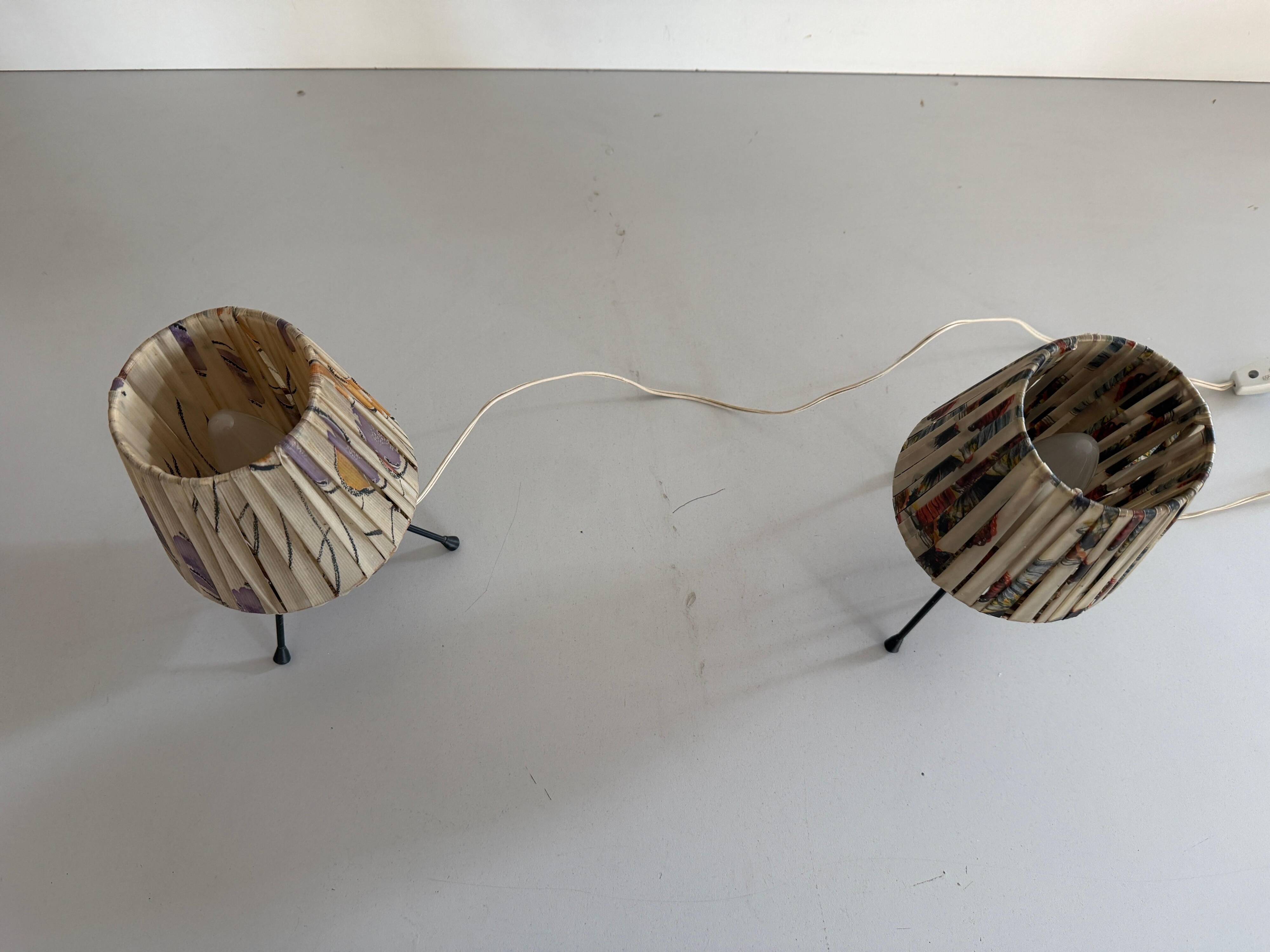 Pair of table lamps with plastic shades and tripod base, 1960s, Italy