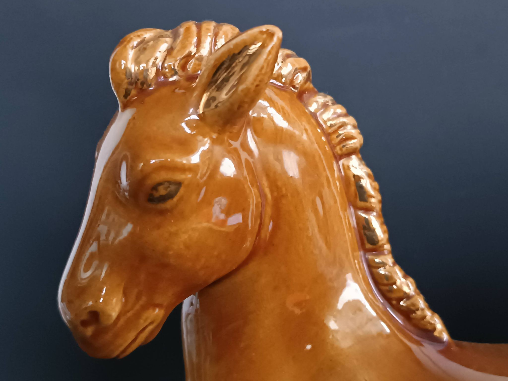Ceramic horse sculpture with wild glaze and gold, signed Art Deco.
