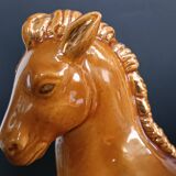 Ceramic horse sculpture with wild glaze and gold, signed Art Deco.